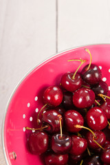Fresh cherries in colander