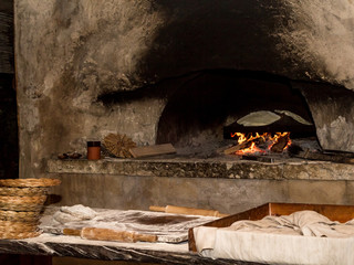 Baking flatbread in outdoor oven, Nazareth Village - obrazy, fototapety, plakaty
