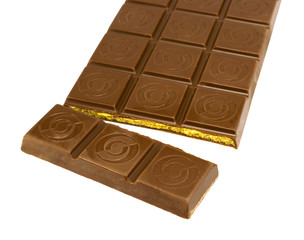 a broken tile with caramel filling of chocolate isolated on whit