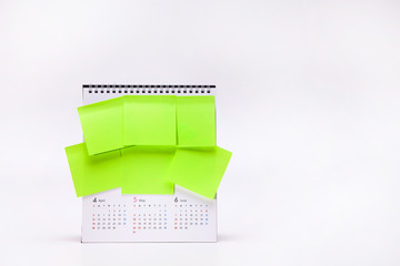 Many of green stick papers on a calendar