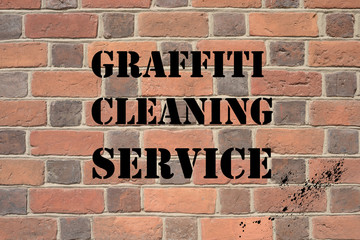Graffiti cleaning service brick wall