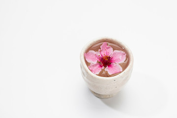 Plum blossom tea on a white 