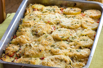 Potatoes and tomatoes baked with cheese