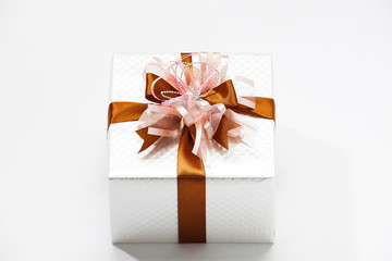 Silver gift box with gold ribbon