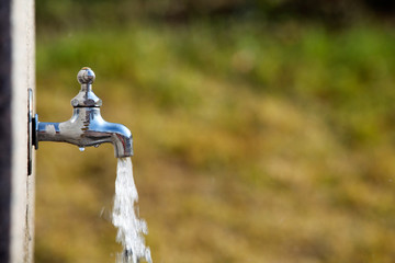 Opening water tap in a park