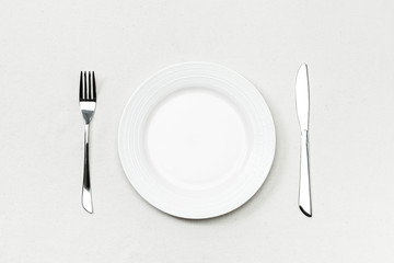 Plate,fork and knife on a white