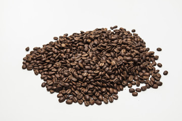 Roasted coffee beans on white background