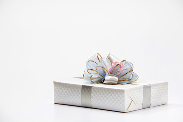 Silver white gift box with ribbon