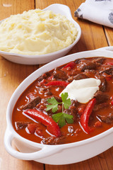 Goulash with red peppers and sour cream