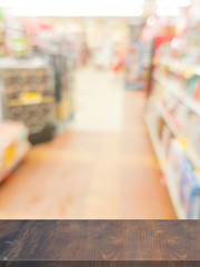 Empty wood table top on blurred in Supermarket Product Display