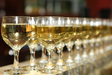 A lot of glasses of alcoholic drink in the bar