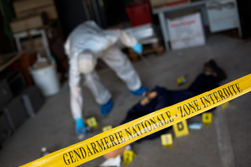 French gendarmerie forensics examining a crime scene.