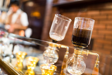Coffee siphon in use