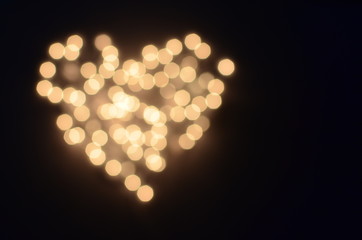Bokeh lights background in a heart shape