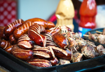 Grilled, roasted sausages on the barbecue, meat food, selective focus