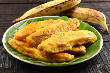 Traditional  fried banana fritters in leaf,