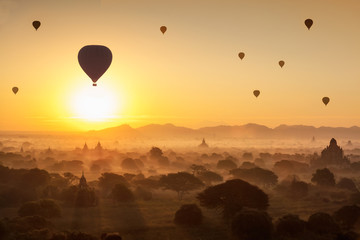 Beautiful sunrise and hot air balloons over ancient pagoda in Bagan is old kingdom in past, Myanmar