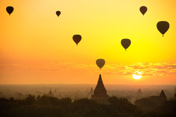 Beautiful sunrise and hot air balloons over ancient pagoda in Bagan is old kingdom in past, Myanmar