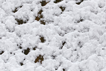 Snow on the wooden fence as a backdrop