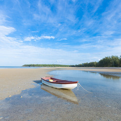 small boat on the beach