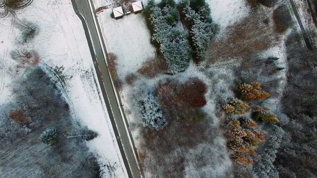 Aerial Of Road And Woods In Snowy Winter