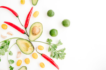 Raw food: avocado, chili pepper, coriander, cherry tomato, lime, garlic. Flat lay, top view. Food concept.