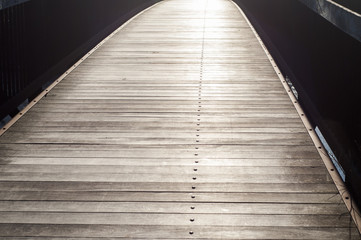 Fototapeta premium Surface of wooden boards with metal bolts in perspective as background