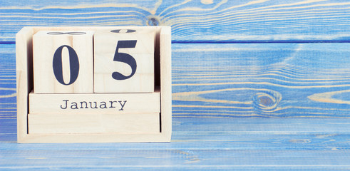 Vintage photo, January 5th. Date of 5 January on wooden cube calendar