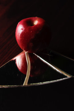 Red Apple On Broken Mirror