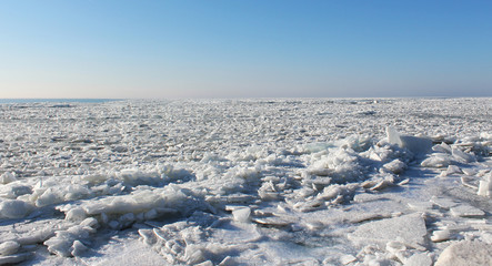 Ice cracks on frozen lake - winter