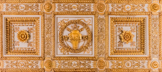 Ornate golden ceiling decorations in a basilica in Rome