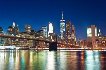 Fototapeta na wymiar Manhattan Skyline, Brooklyn Bridge, Waterfront. at night