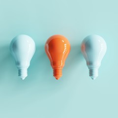 pantone pastel light bulbs with contrast colos on white background. minimal concept. top view..