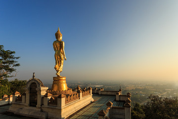 Fototapeta premium Golden buddha statue in Thai temple, Wat Phra That Khao Noi in N