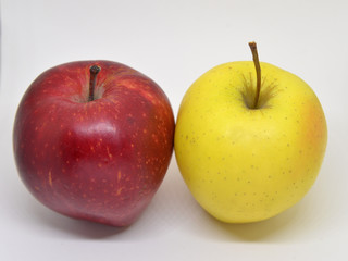 Red yellow apple with green leaf and slice isolated on white background