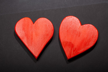 Holidays gift and heart on a black background. Valentines day