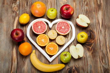 Fruits heart on the wooden background