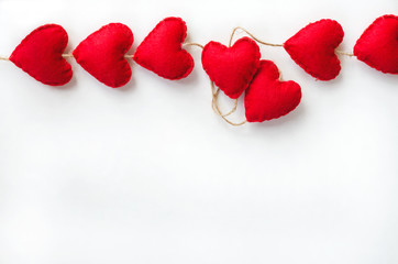 Red hearts border on white background with copy space. Concept for love or Saint Valentine's Day.