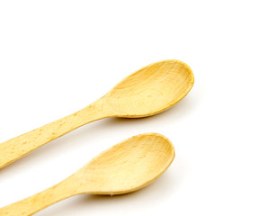 Wooden kitchen utensils isolated on white background.