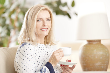 Ageless beauty. Attractive senior woman relaxing at home