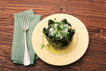 Baked artichoke on wooden background