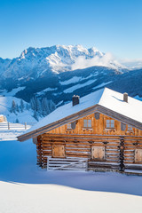 Wooden mountain chalet in the alps in winter