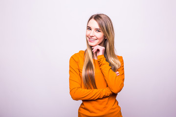 Happy blonde girl in orange t-shirt on white