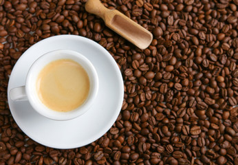 A cup of coffee on beans background