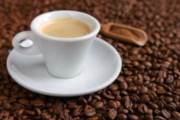 A cup of coffee on beans background