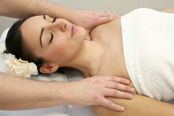 Obraz na płótnie Canvas Woman enjoying a massage treatment.