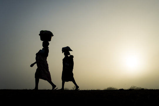 Mozambican ladies in the early morning mist