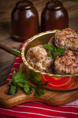 Fried pork chops in the pan.