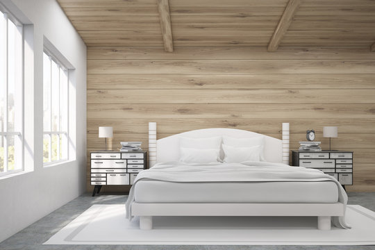 Front view of a double bed in a room with wooden walls and ceiling. There are two bedside tables and two large windows. 3d rendering. Mock up. Toned image
