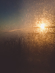 Blurred droplet on room windows and sun light abstract background